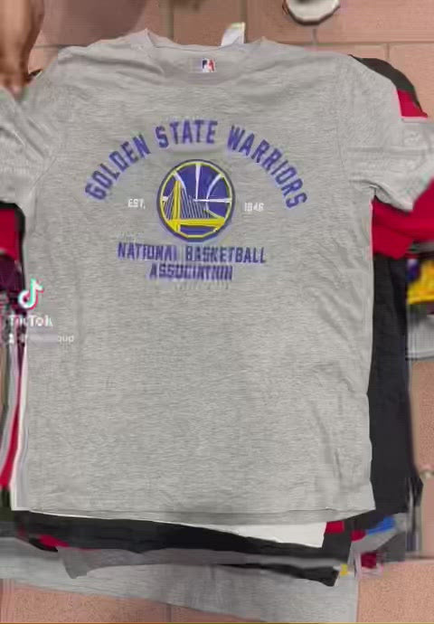 A mixture of Unbranded American Pro Sports College Universities T-shirts 45KG Bale